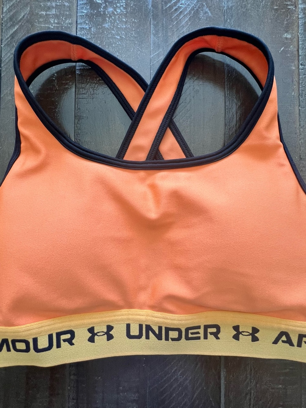 Under Armour Orange Sports Bra with Black Trim and Gold Logo Band